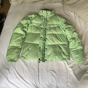 Mint colored puffy jacket with rainbow inside